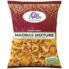 Packaged snack labeled 'Madras Mixture' with a brand logo on a red background